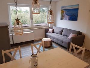 Et opholdsområde på FeWo Ankerplatz mit Meerblick direkt am Strand