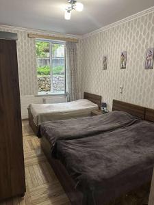 Postel nebo postele na pokoji v ubytování Guest house Maspindzeli