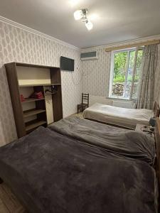 Postel nebo postele na pokoji v ubytování Guest house Maspindzeli