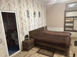Postel nebo postele na pokoji v ubytování Guest house Maspindzeli