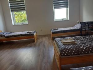 Postel nebo postele na pokoji v ubytování Apartmány Kortan