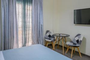 A bed or beds in a room at Koukaki Home
