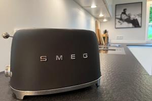 a black toaster sitting on top of a counter at Klopfer Haus Oberstdorf in Oberstdorf