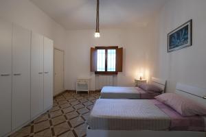 Postel nebo postele na pokoji v ubytování CA SUMMA agriresort + 40 fotografií