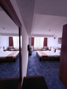 Postel nebo postele na pokoji v ubytování Nairi Hotel Yerevan