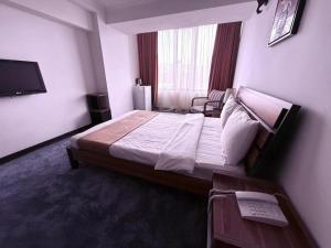 Postel nebo postele na pokoji v ubytování Nairi Hotel Yerevan