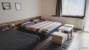 Postel nebo postele na pokoji v ubytování Penzion Daniela