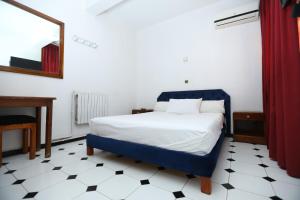 Postel nebo postele na pokoji v ubytování Raiss Hotel