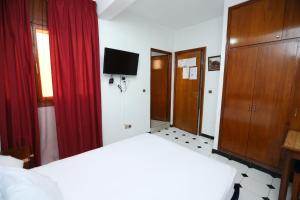 Postel nebo postele na pokoji v ubytování Raiss Hotel