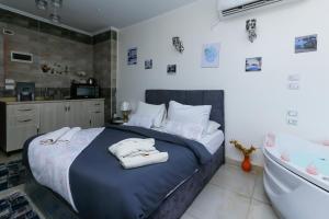 Katil atau katil-katil dalam bilik di Luxury pyramids jacuzzi view inn