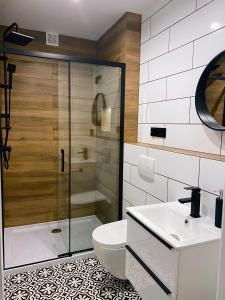 Koupelna v ubytování Magiczne Poranki Apartamenty Myczków + 54 fotografií