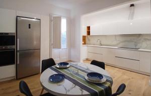 a kitchen with a table and chairs in a room at 1 Bedroom Nice Apartment In Casalguidi in Cantagrillo