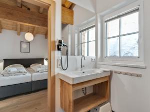 A bed or beds in a room at Modern Chalet in Mühlbach am Hochkönig near Ski Area