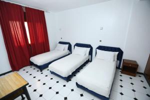 Postel nebo postele na pokoji v ubytování Raiss Hotel