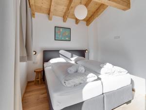 A bed or beds in a room at Modern Chalet in Mühlbach am Hochkönig near Ski Area