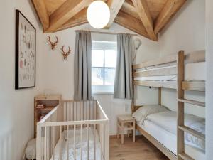 A bed or beds in a room at Modern Chalet in Mühlbach am Hochkönig near Ski Area
