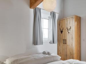 A bed or beds in a room at Modern Chalet in Mühlbach am Hochkönig near Ski Area