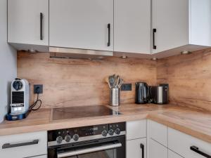 A kitchen or kitchenette at Modern Chalet in Mühlbach am Hochkönig near Ski Area