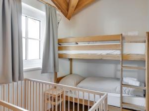 A bed or beds in a room at Modern Chalet in Mühlbach am Hochkönig near Ski Area