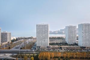 a view of a city with tall buildings at Town Designer B&B in Qingdao