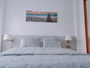 Ένα ή περισσότερα κρεβάτια σε δωμάτιο στο Apartamento Luminoso 35N