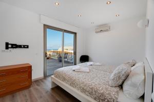 En eller flere senge i et værelse på Villa Arenas 3 Playa la Arena + 33 billeder