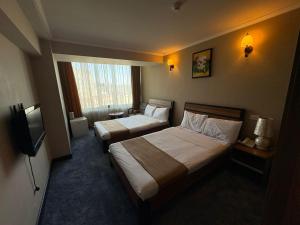 Postel nebo postele na pokoji v ubytování Nairi Hotel Yerevan