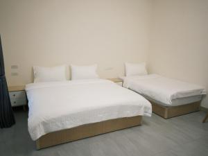 Katil atau katil-katil dalam bilik di 瑞穗阿牛的家 Rui Sui Moo Guesthouse