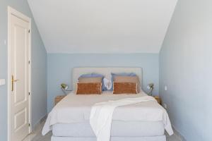 Posteľ alebo postele v izbe v ubytovaní Apartamento Giralda