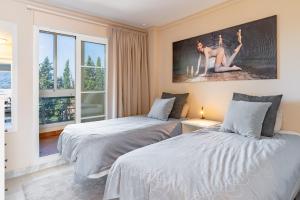 Posteľ alebo postele v izbe v ubytovaní Apartamento Giralda