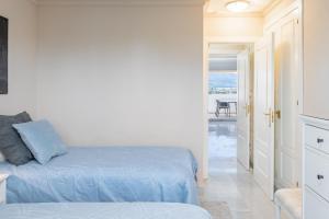 Posteľ alebo postele v izbe v ubytovaní Apartamento Giralda