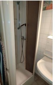 a shower in a bathroom next to a sink at Villa Mon Repos 2 in La Bourboule