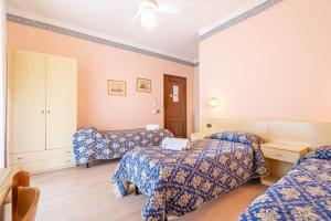 Postel nebo postele na pokoji v ubytování Hotel Marnie
