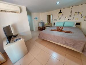 Postel nebo postele na pokoji v ubytování TaKaYai GuestHouse