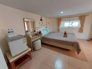 Postel nebo postele na pokoji v ubytování TaKaYai GuestHouse