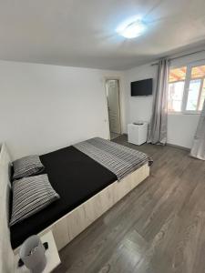 Postel nebo postele na pokoji v ubytování Vila Aron
