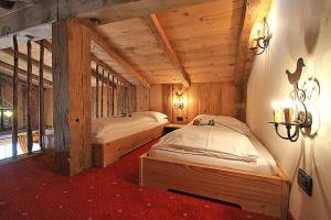 Postel nebo postele na pokoji v ubytování Hotel Garni San Nicolò