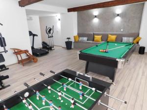 a living room with a pool table and a couch at Del Mar Rab in Kampor +16 photos