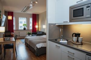 Kuchyň nebo kuchyňský kout v ubytování Home Hotel Mektagonen