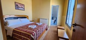 Ліжко або ліжка в номері Hotel Vlora