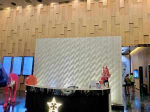 a large white wall with a table in a building at STAR KLCC By Comfort Hospitality in Kuala Lumpur