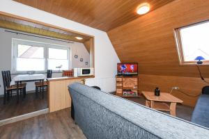 TV a/nebo společenská místnost v ubytování Ferienwohnung im Haus Wangerooge