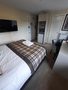 Voodi või voodid majutusasutuse Dalkeith Aparthotel toas