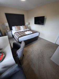 Voodi või voodid majutusasutuse Dalkeith Aparthotel toas