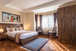 Postel nebo postele na pokoji v ubytování Hotel Kutumba + 37 fotografií