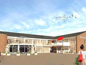 een groep vogels die in de lucht boven een gebouw vliegen bij 6 person holiday home in Ringkøbing in Ringkøbing