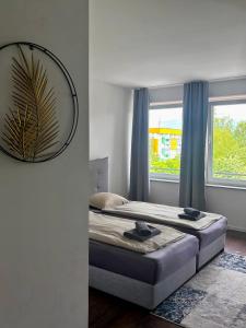 a bedroom with a bed and a mirror on the wall at Sobe PALMA in Sanski most +2 photos