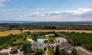 an aerial view of a villa with a golf estate at Casal Sikelio in Cassibile