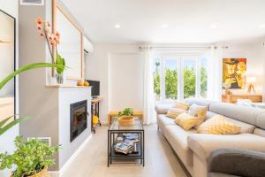 a living room with a couch and a fireplace at Lliris 29 in Palmanyola