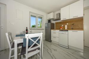 Kuchyň nebo kuchyňský kout v ubytování Studio Apartman Zlata